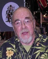 Photograph of Gary Gygax taken at en:Gen Con Indy 2007 on en:2007-08-16. Gygax is standing in the en:Troll Lord Games booth (booth 515). The photograph was taken by and is copyright 2007 by the uploader, Alan De Smet. The photograph is multi-licensed under the Creative Commons Attribution 2.5 and 3.0 licenses