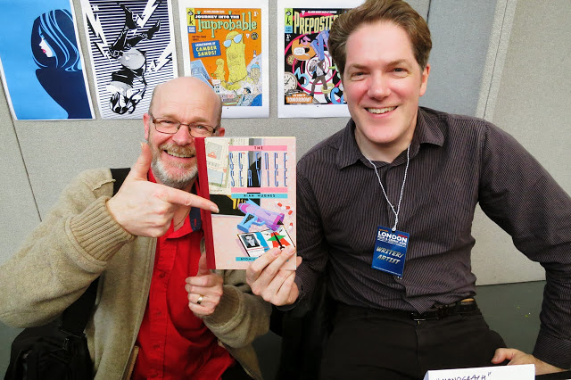 John Freeman with Rian Hughes at a London Comic Con, pictured here with a copy of ‘Science Service’ a project for Belgian publisher Magic Strip, John's first commercial commission as a comic writer back in the 1980s. Photo: Steve Cook