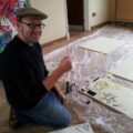 Neill Cameron at work on his giant comics mural for the Story Museum, Oxford. Image courtesy the Story Museum