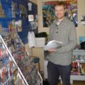 First Age Comics, Lancaster's co-owner Mark Braithwaite in the shop's new store at 13 Moor Lane, busy shelving new issues of US comics.
