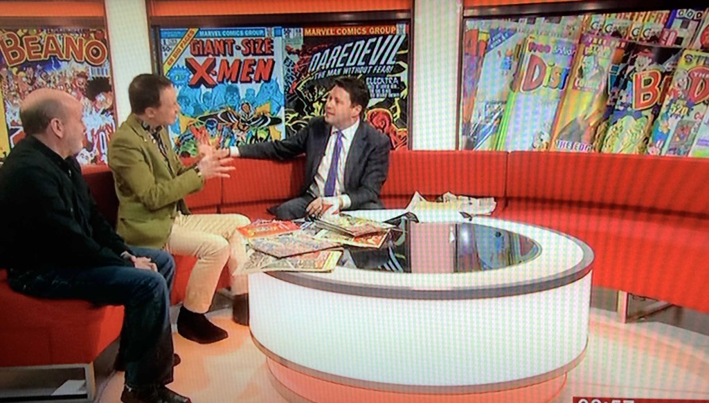 Paul Gravett on BBC News with David Huxley, talking about the British Library's Comics Unmasked exhibition