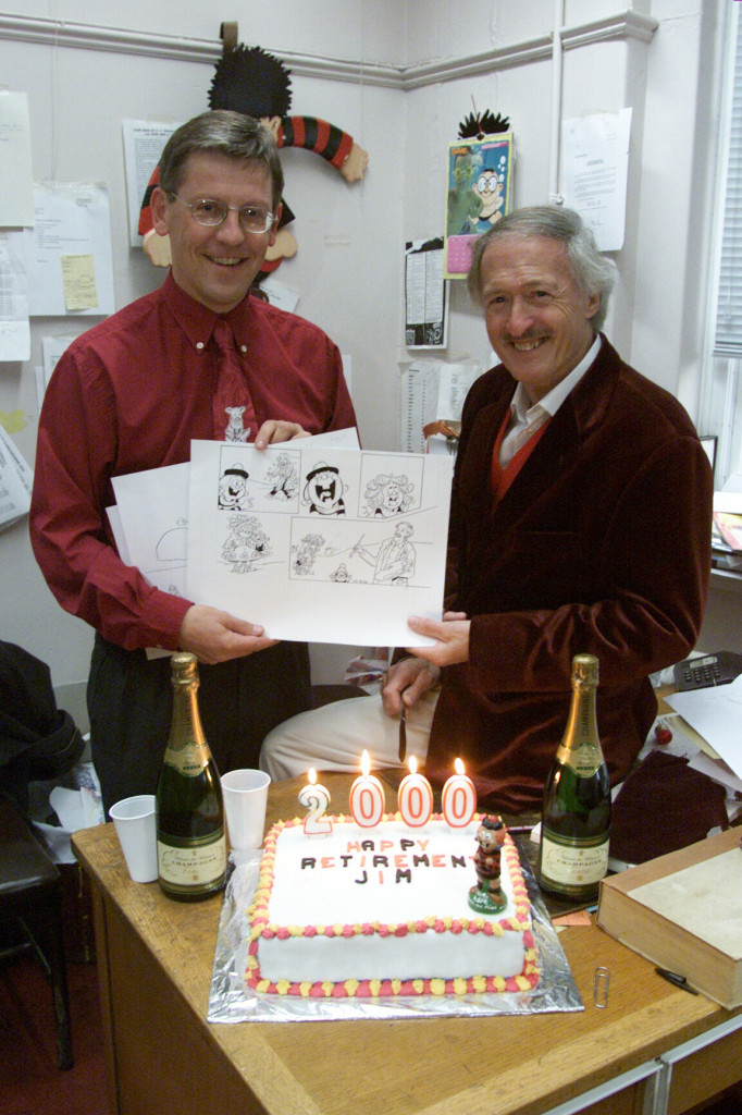 Former Beano editor Euan Kerr and Jim Petrie , the artist who drew the Beano character Minnie the Minx for 40 years before announcing his retirement on Monday 8th January 2001. Euan seen here presenting Mr Petrie with champagne and a retirement cake that day. Image courtesy DC Thomson