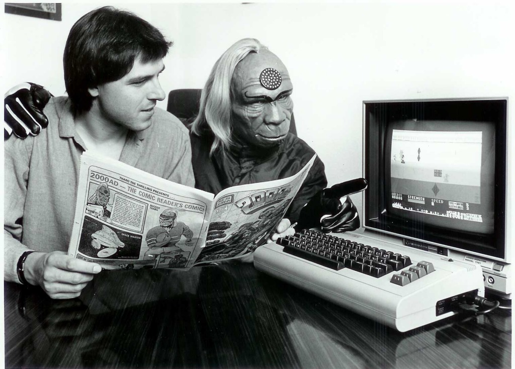 Tharg during his first few years on Earth, explaining to a magazine editor that computers work better worn on your wrist.