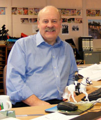 Bill Graham at his desk at DC Thomson