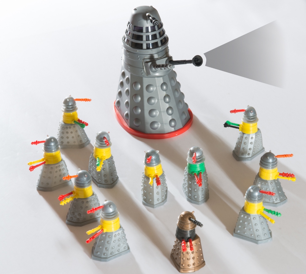 Eleven Dalek Swapits produced by by Cherilea Toys in 1965, with a Louis Marx Dalek - a 6½" tall toy, lacking battery operated interior. The Swapits were exclusive to Woolworths and originally cost a shilling each. The rarest gold/black Dalek Swapit is included here. 2½" tall.