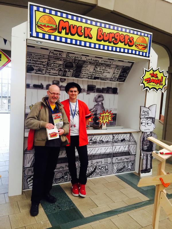 You;re never too old to win a Muckburger from Zoom Rockman! John Freeman with Zoom at the Lakes International Comic Art Festival. Photo: Kate Lennard