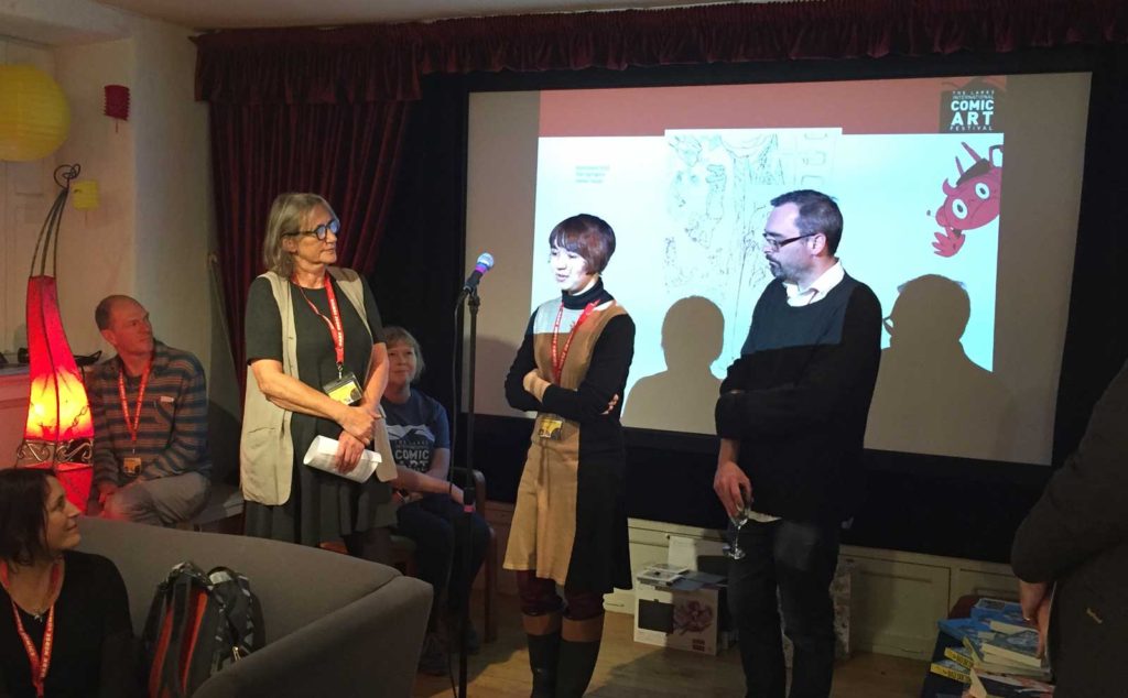 Jade Sarson (centre) talks about the work of Myriad Editions at the launch of its latest competition, flanked by Managing Editor Corinne Pearlman and fellow creator Gareth Brookes