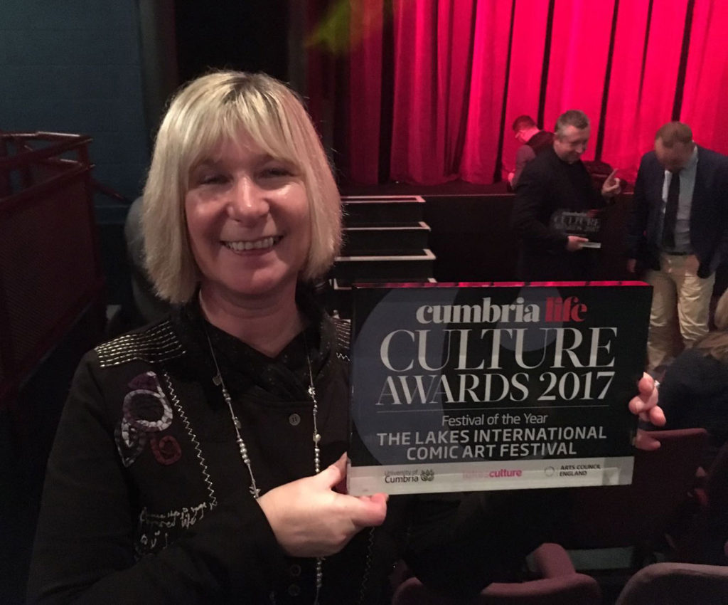 LICAF team member Carole Tait with the award for Festival of the Year