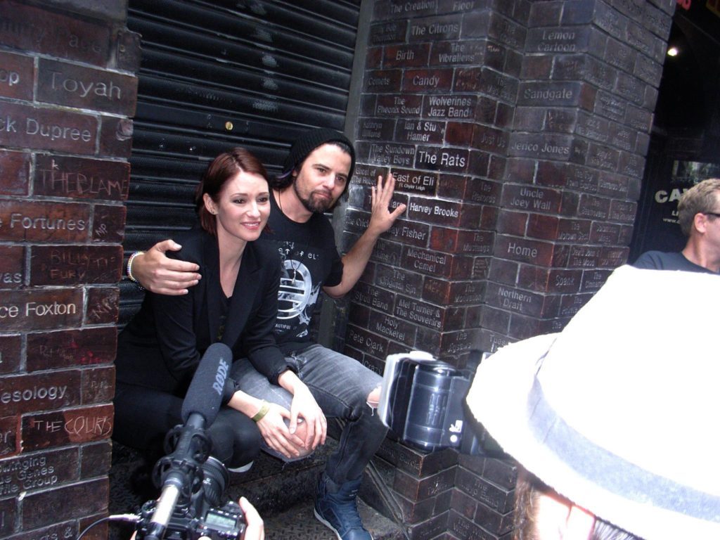 Chyler Leigh and Nathan West get their own brick in the wall on the Cavern Club's Wall of Fame. Photo courtesy Tim Quinn