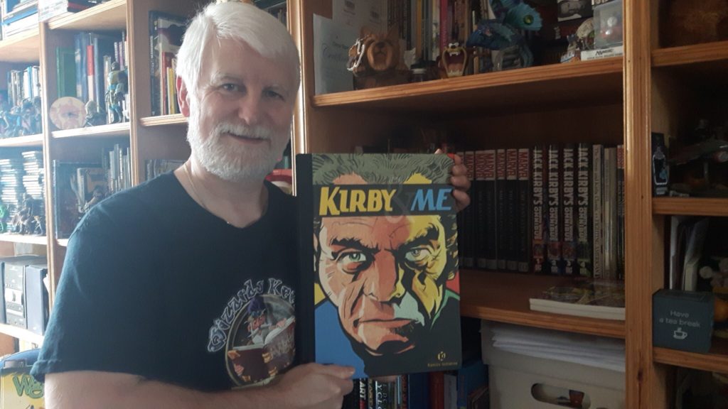 Tim Perkins with a copy of the tribute book Kirby and Me
