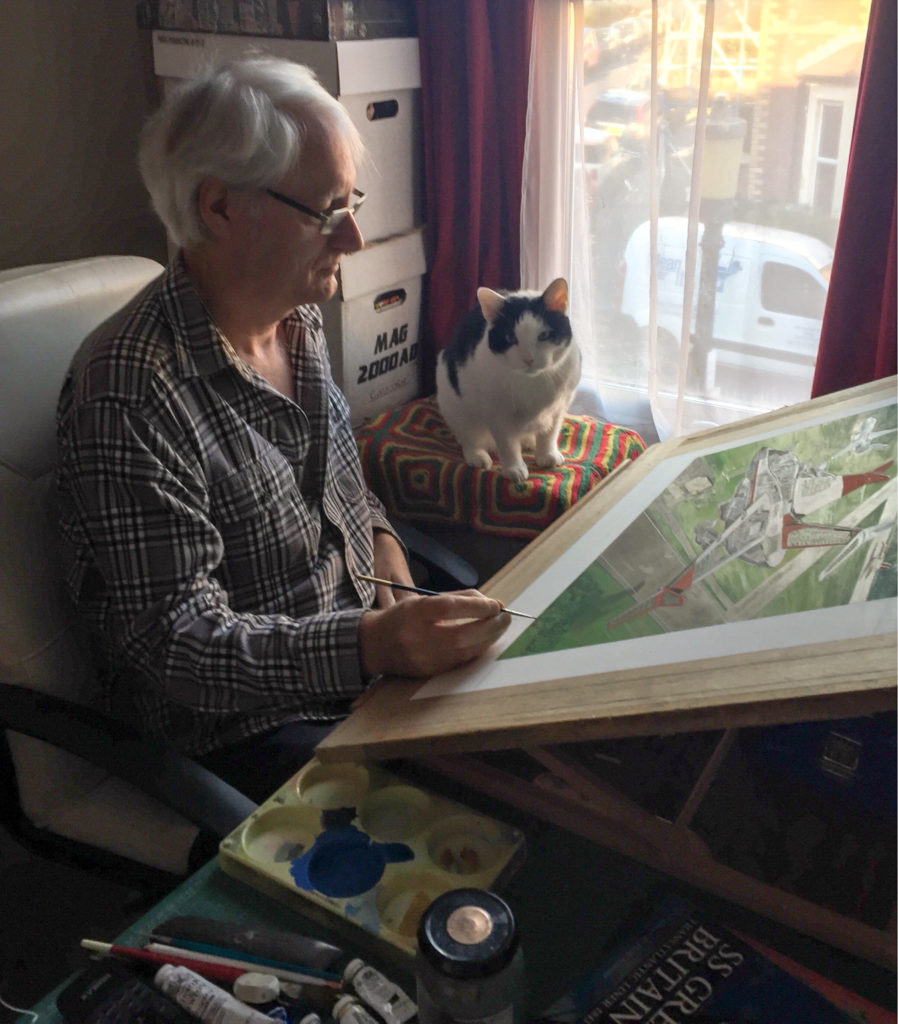 Graham Bleathman with his cat "helper", 13-plus Pixel, who usually sits on his box in the afternoon supervising and doing his Neighbourhood Watch duty. Photo: Katie Bleathman