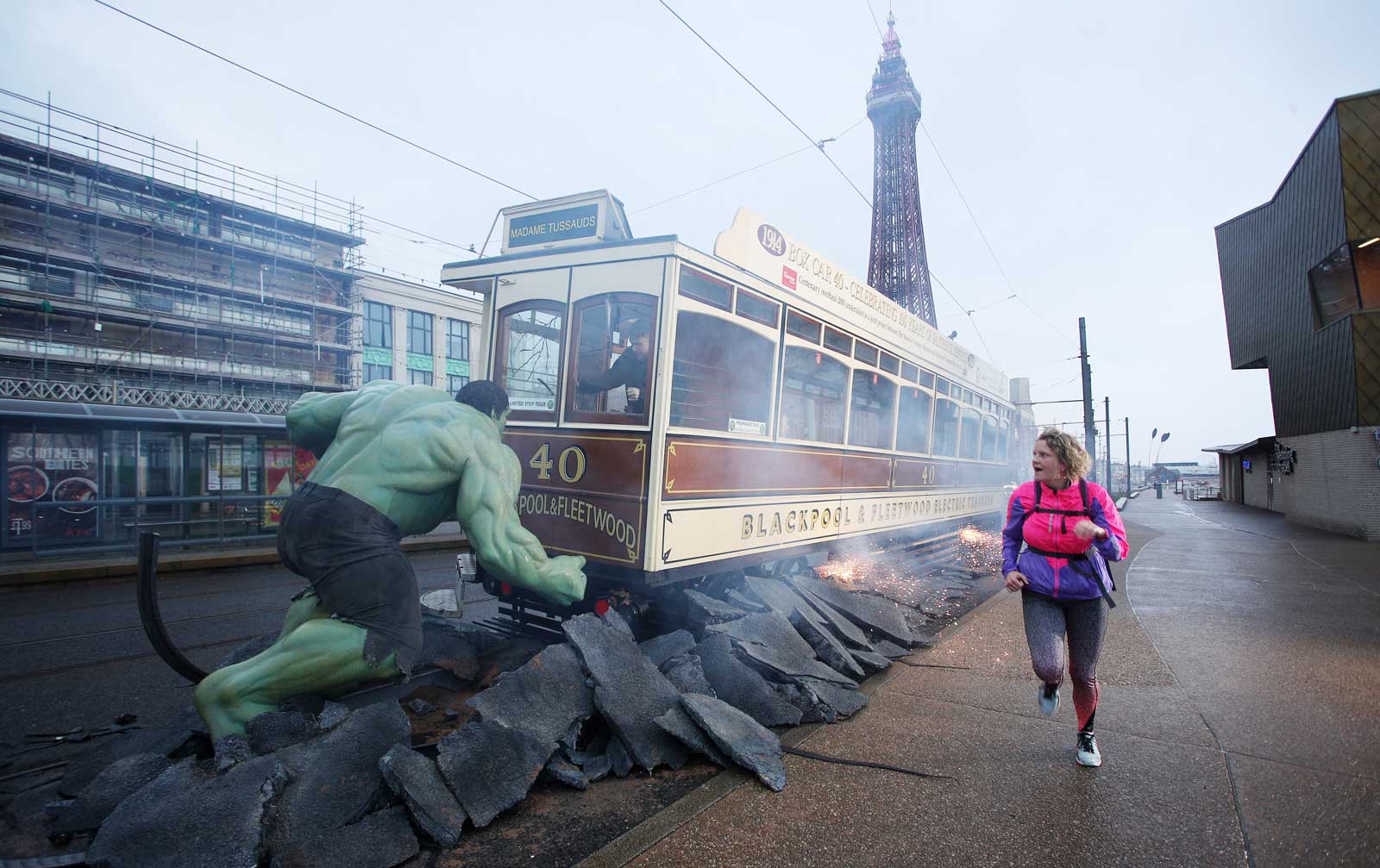 An early morning jogger gets a bit of a surprise as the Hulk takes on a Blackpool tram. Image: Madame Tussauds