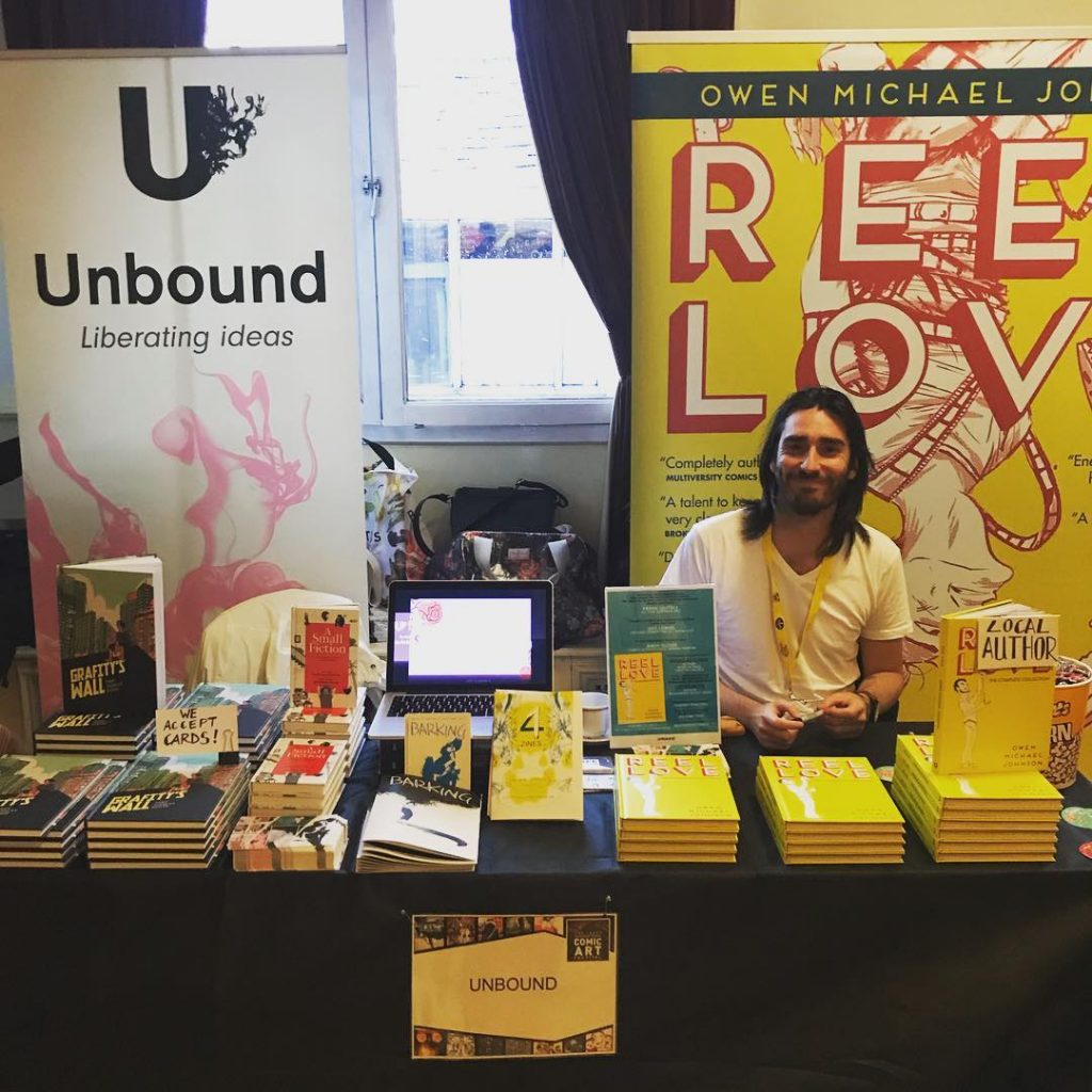 Reel Love author Owen Michael Johnson on the Unbound stand at the Lakes International Comic Art Festival 2018. Photo: Unbound