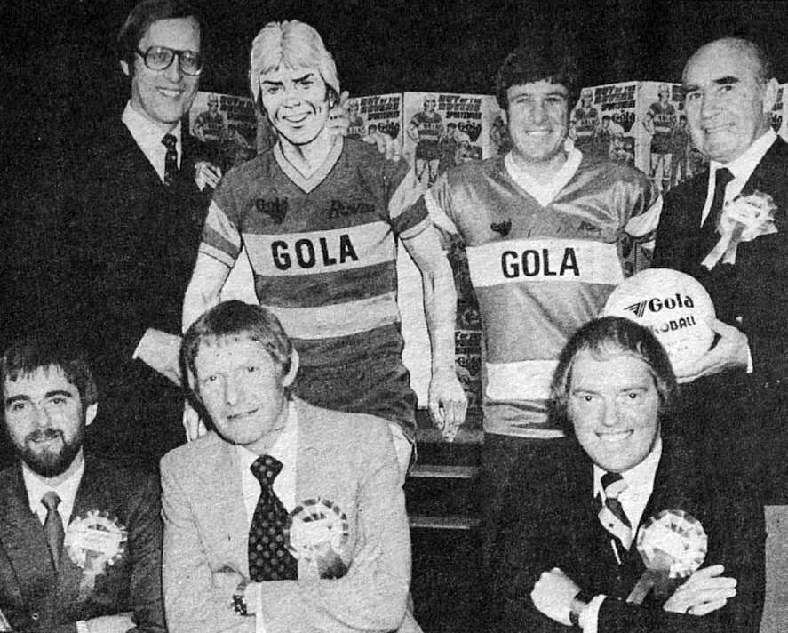The original Gola launch event in the 1980s. Quite a line-up! Front row, left to right: editor Ian Vosper, writer Tom Tully, artist David Sque. Back row: Group editor Barrie Tomlinson, Roy, Emlyn Hughes, Sir Alf Ramsey. Photo courtesy Barrie Tomlinson