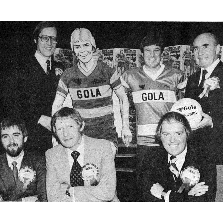 The original Gola launch event in the 1980s. Quite a line-up! Front row, left to right: editor Ian Vosper, writer Tom Tully, artist David Sque. Back row: Group editor Barrie Tomlinson, Roy, Emlyn Hughes, Sir Alf Ramsey. Photo courtesy Barrie Tomlinson