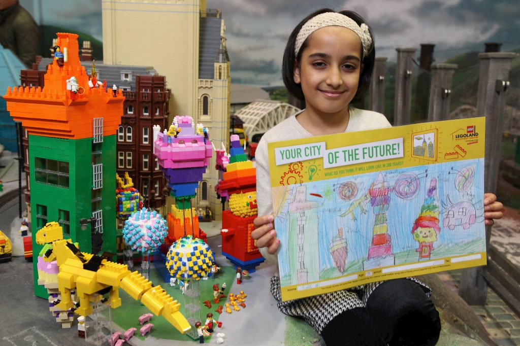 Saira Ali with her winning entry in a nationwide "Cities of the Future" competition, which been brought to life in a giant LEGO model, built by a Master Model Builder.