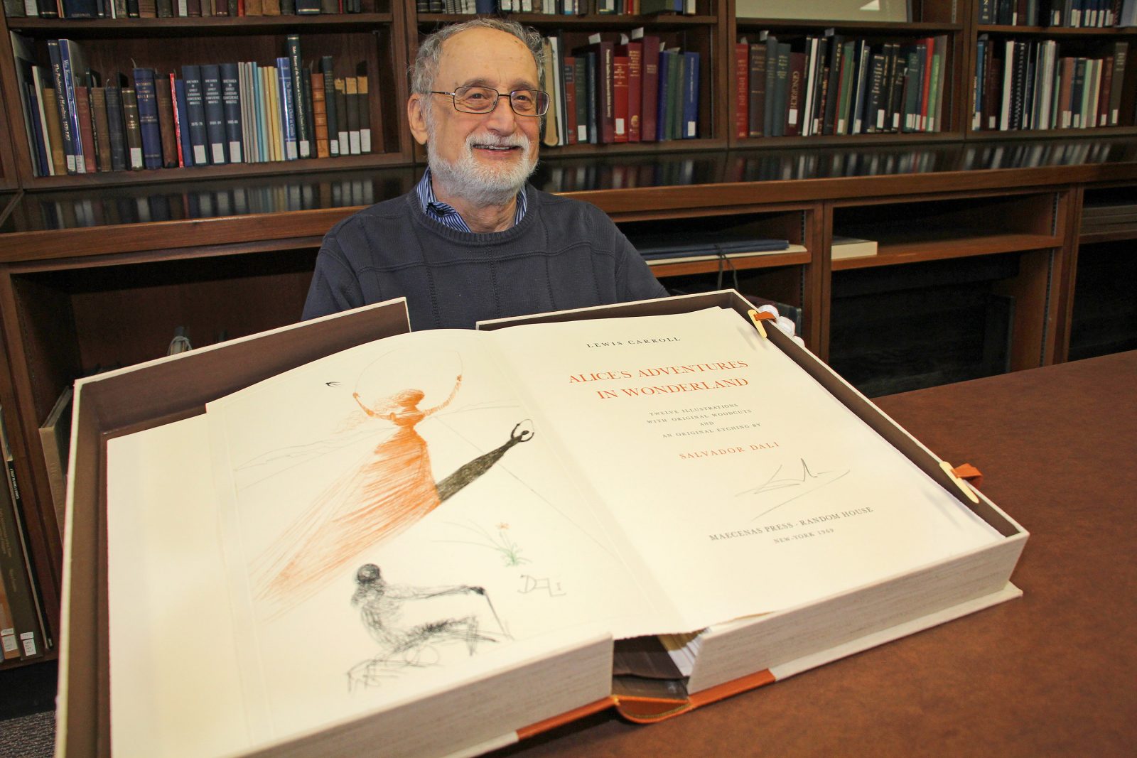 Stuart Rothstein, a retired Brock chemistry and physics professor, donated a rare version of Alice's Adventures in Wonderland, illustrated by Salvador Dali, to Brock University's Special Collections in 2017. Image: Brock University