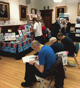 CCGB members Tim Harries, Noel Ford and Rich Skipworth live drawing during a rare quiet moment at the Lakes International Comic Art Festival in 2018