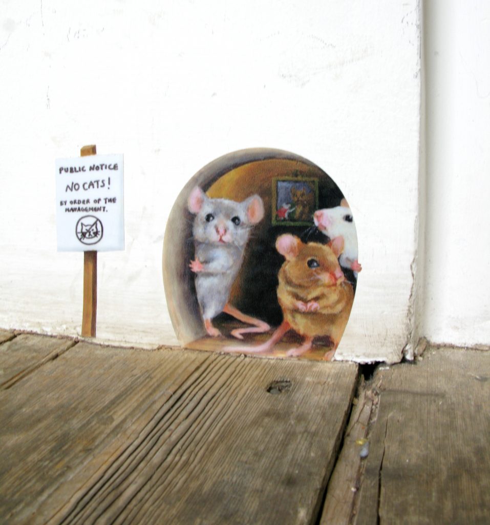 These mice are holding a tentative protest against the cats in your home! Although they probably won't be successful in scaring off any felines, they are guaranteed to make visitors smile! This sticker fits nicely on a standard skirting board, but would look great on the stairs or the window ledge- maybe you even have a cat free zone they'd be perfect for? They're suitable for outdoor use too if you can find a smooth flat surface.