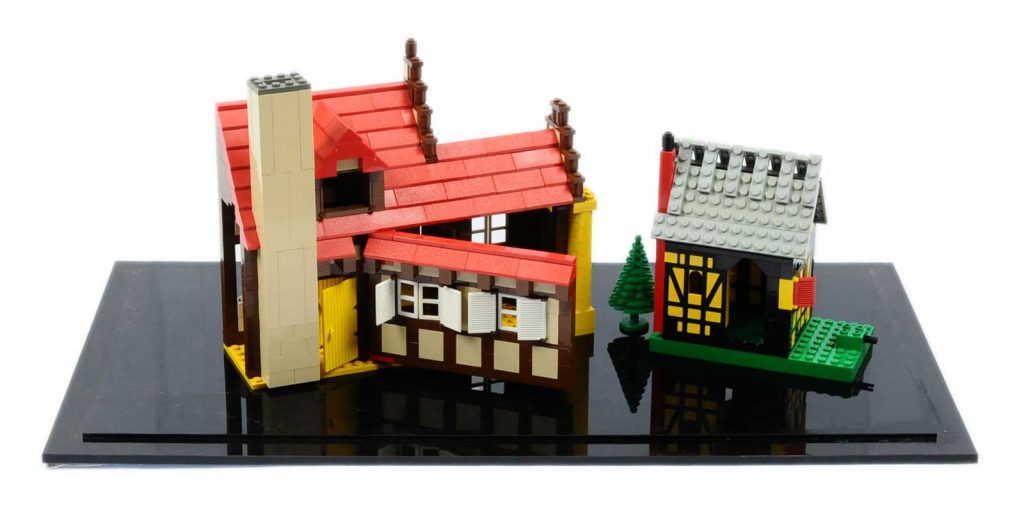 Rare Lego Buildings from the personal collection of Daniel Krentz (1937-2016) from his home in Denmark. Daniel was a well known Lego designer responsible for such classics as 375 Castle and 6074 Black Falcons Fortress. The two buildings are contained loose in a perspex case and plinth and come with a certificate of authentication, previously auctioned by Fairybricks in 2017