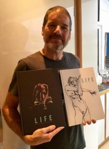 Charlie Adlard with copies of his LIFE drawing collection