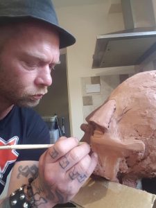 Artist Neil Blackbird Sims at work on a sculpt of the Mekon he created "just for fun"