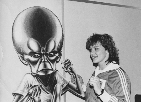 Kathy Tayler, champion modern pentathlete, now a TV presenter drops into the Roy of the Rovers office and encounters  the dreaded Mekon, who had escaped from  Eagle. "The Mekon's hand had broken off and Kathy is kindly holding it in place!" Barrie recalls. Image via Barrie Tomlinson