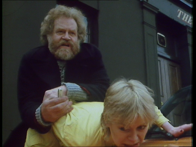 Actor and stunt man Max Faulkner threatens Jo (Emma Relph) in Day of the Triffids