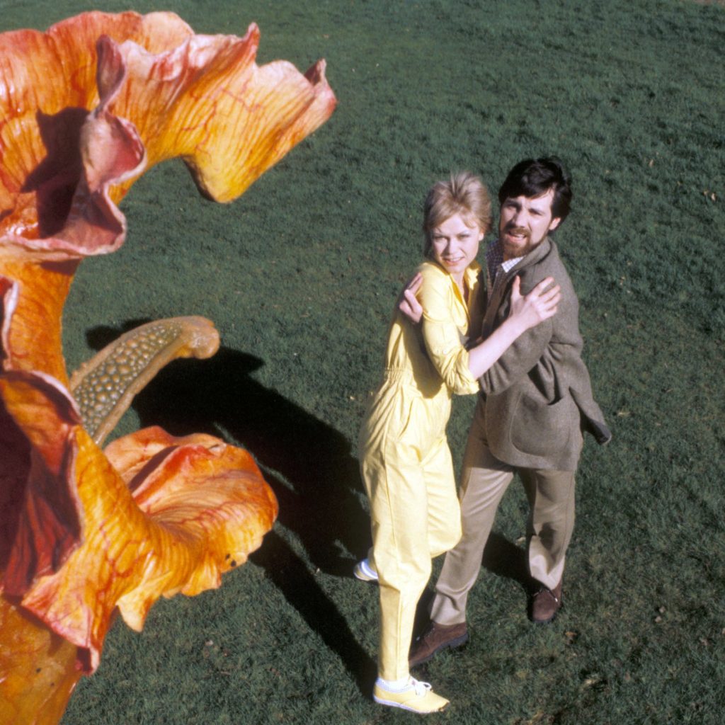 Emma Relph as Jo Playton, John Duttine as Bill Masen - and a Triffid as itself. This image was used as the cover for the Radio Times to promote the new series. Image: BBC