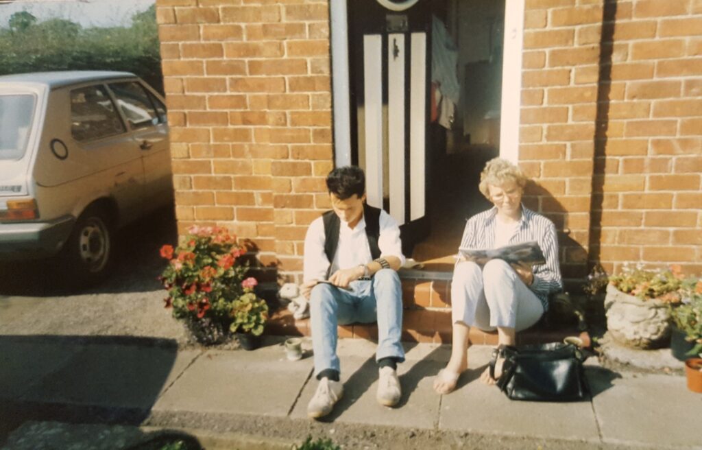 A young Stephen L. Holland reading comics with his Mum!