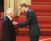 Artist Jon Davis receiving his MBE. Photo courtesy Jon’s family