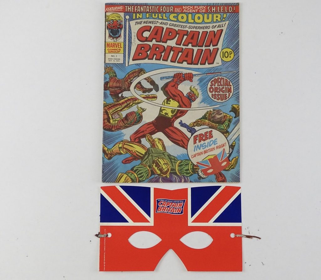 Captain Britain #1 - (1976 - BRITISH/MARVEL - UK Price) - featuring the Origin and First appearance of Captain Britain + Free gift included (PUNCHED MASK) - Larry Lieber cover with Herb Trimpe interior art with Chris Claremont story