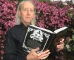 Bryan Talbot with a copy of Grandville L'Integrale