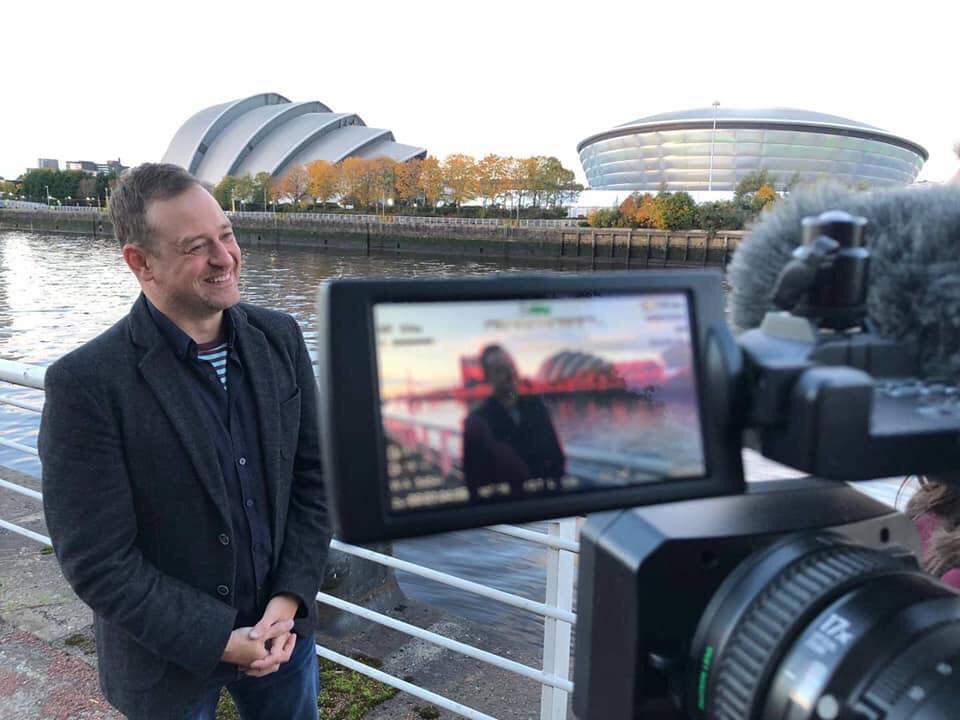 The Most Important Comic Book on Earth editor and strip writer Paul Goodenough promoting the fundraising title at COP26 in Glasgow this week. Photo: #RewritingExtinction