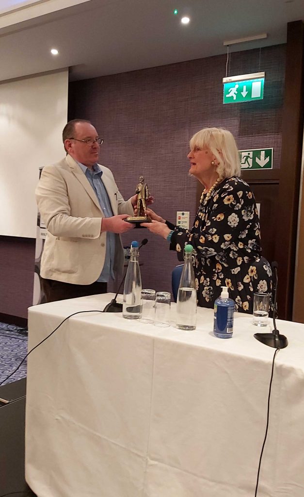 Gary Russell is presented with the inaugural Terrance Dicks Award for writers by Elsa Dicks. Photo courtesy the Doctor Who Appreciation Society