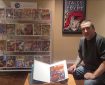 Dave Dustin with his copy of Commando Comics, published by Cartoon Art Productions