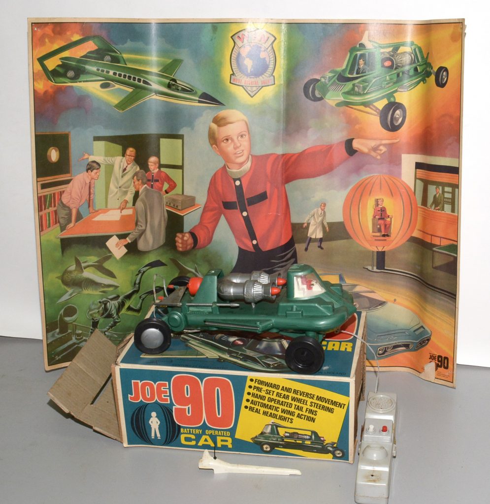 Century 21 Toys Ltd. battery-operated Joe 90 car, boxed; together with a 1968 ATV Ltd. Joe 90 poster, 53 x 69cms