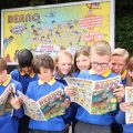 Pupils from Voyager Year 5 class at Whitehill Junior School unveil a billboard illustrating their winning joke as they are presented with the Beano ‘Britain’s Funniest Class’ trophy, Hertfordshire. Picture date: Wednesday June 29, 2022. The class came up with the winning joke, “What do you call a class of children who eat potatoes using their toes? - The Mash Street Kids!”. The competition was fierce this year with hilarious jokes coming in from across the nation and receiving over 190,000 votes by the public. The annual initiative, created by Beano in partnership with young people’s mental health charity YoungMinds, is now in its fourth year. Photo credit should read: Joe Pepler / PinPep