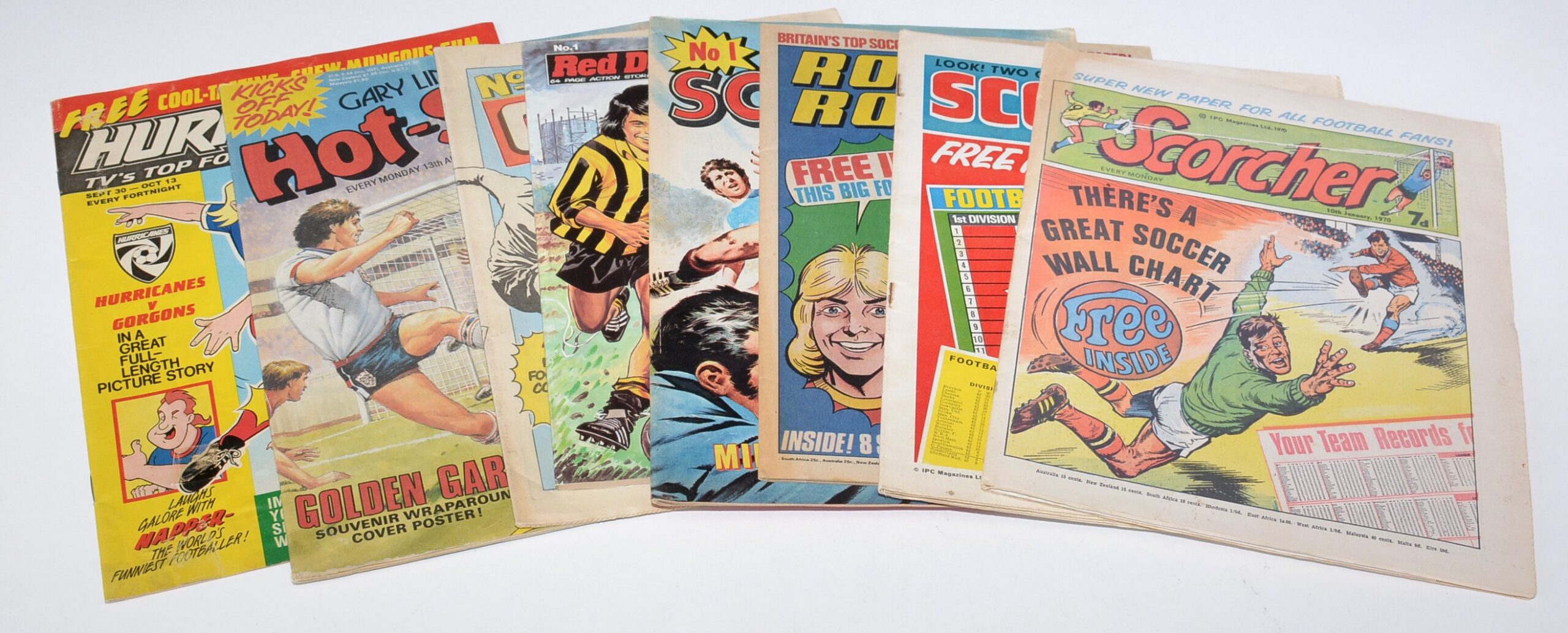 Anderson & Garland Comics Auction 2022. Scorcher, No. 1, with give-away Soccer Wall Chart (1970); Score 'n' Roar, No. 1, with give-away Soccer Table Chart (1970); Roy of the Rovers, No. 1, with Soccer Performance Chart (1976); Hot Shot, No. 1, with give-away Soccer Fact Finder (1988); and other British Football No. 1 comics.