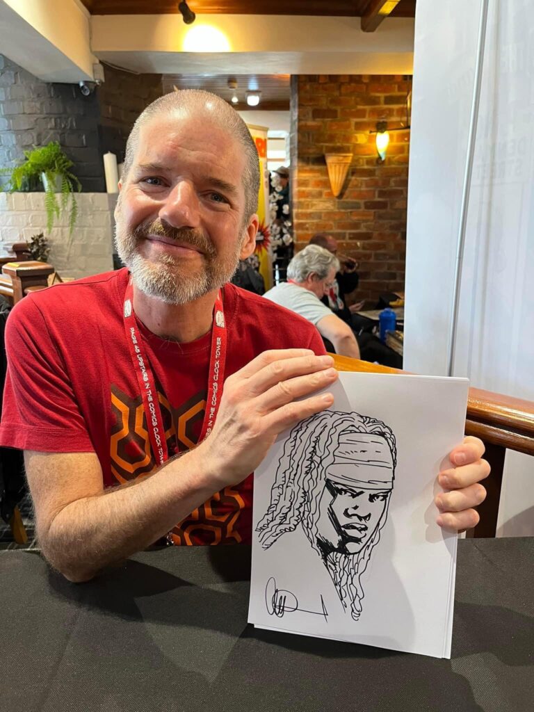 Charlie Adlard with his Michonne from the Walking Dead art