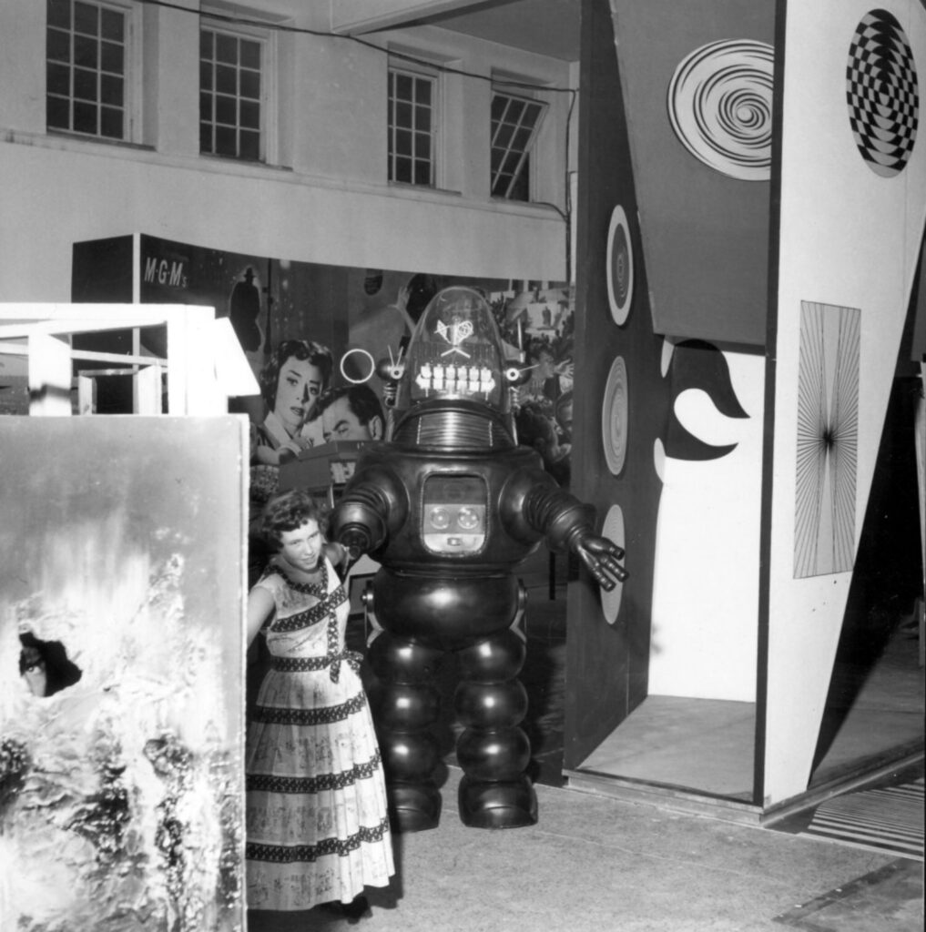 Forbidden Planet’s Robby the Robot puts in an appearance at the grand opening of the innovative “This is Tomorrow” exhibition at the Whitechapel Gallery in 1956