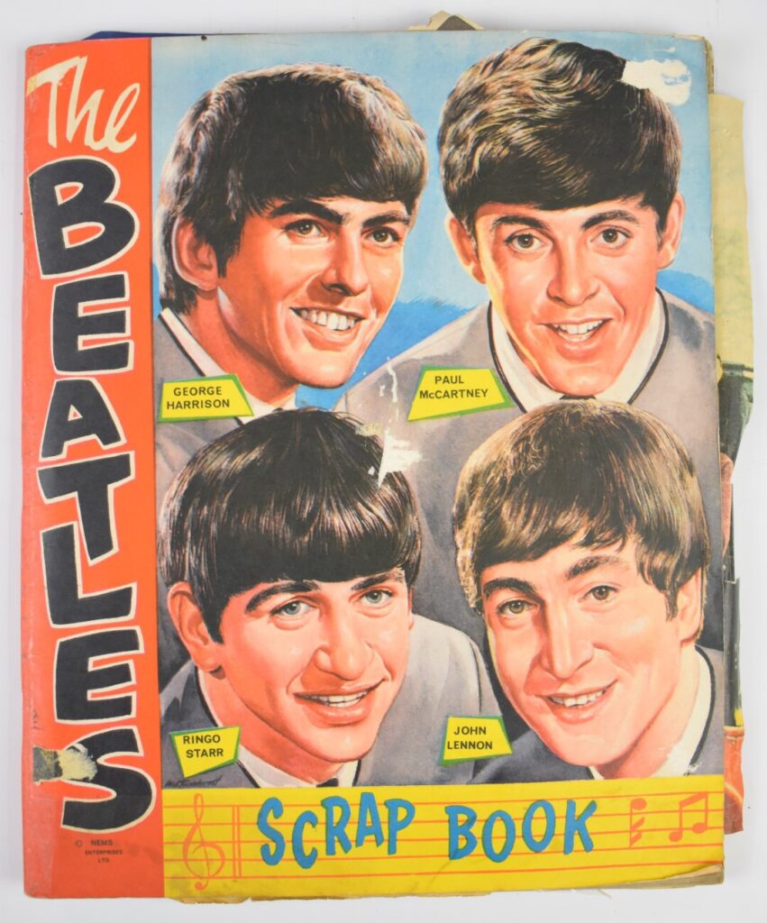 Beatles NEMS scrapbook with colour magazine poster pages and black and white clippings, contents c1963/1964