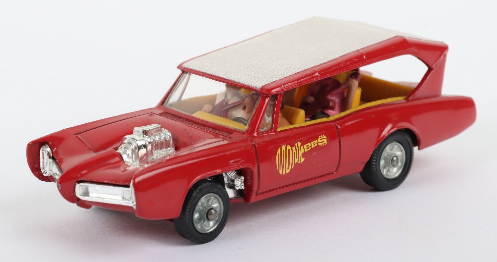 Corgi Toys 277 The Monkees Monkeemobile, red body, white roof, cast wheels, with original figures of Mike, Mikey, Davey & Pete, model is in near mint original un-boxed condition.