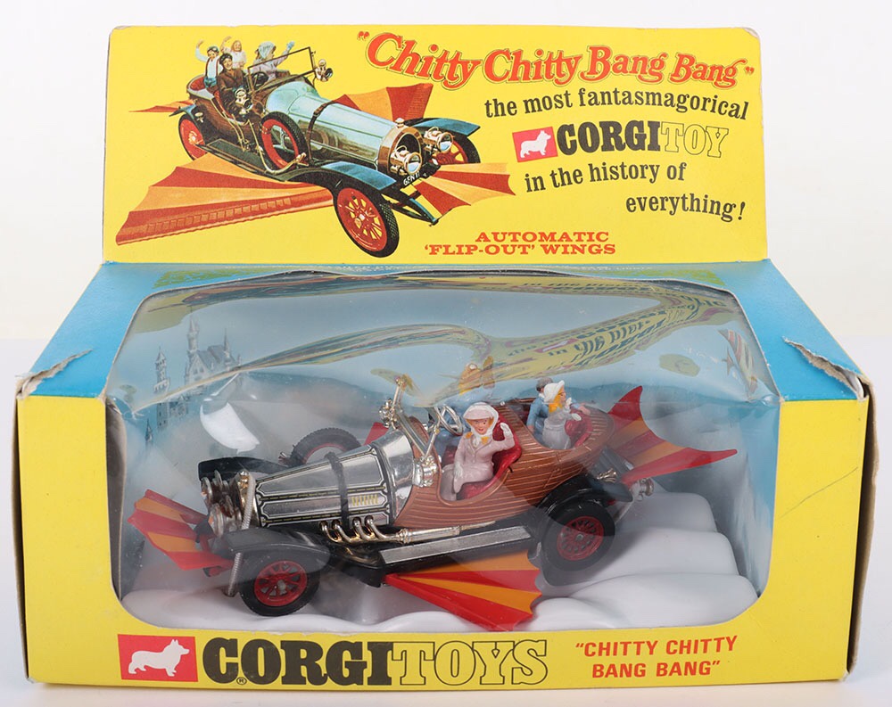 Vintage Corgi Toys 266 "Chitty Chitty Bang Bang" complete with "Caractacus Potts, Truly Scrumptious, Jeremy and Jemima" figures, gold/chrome/bronze body, model is in mint original condition, with back and front wings, including inner plastic cloud, card cloud display, original outer blue and yellow illustrated window box is good, with some edge/age wear/tears.