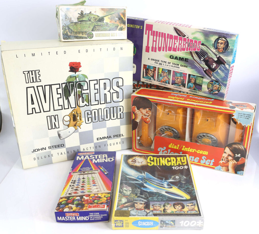 Collection of vintage toys including Avengers talking action figures, Waddington's Thunderbirds game, Transformers and others