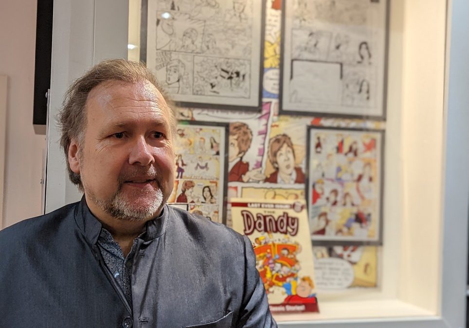 BEANO artist Nigel Parkinson at the “unveiling” of his work featuring Sir Paul McCartney at The Beatles Museum last year. Image: The Beatles Museum