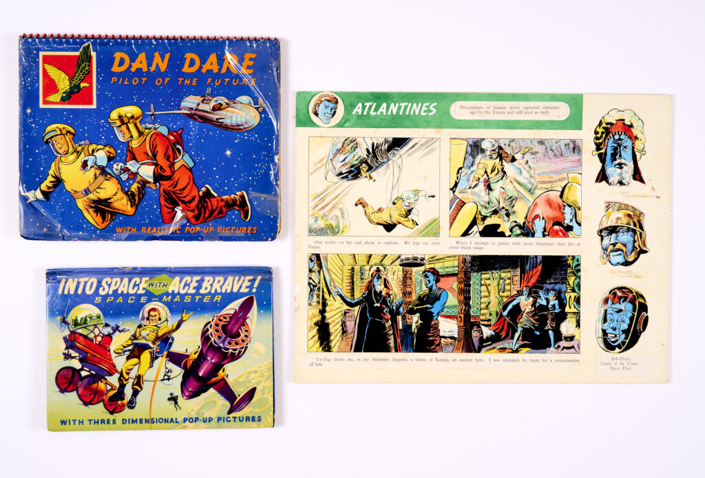 Dan Dare/Atlantines original artwork (1953) by Frank Hampson (some text in original pencil). Poster colour on board. 15 x 12 ins. Offered with a copy of the Dan Dare Pop-Up Book (1953), from which it comes and Into Space with Ace Brave Pop-Up Book (1955), art by Ron Turner