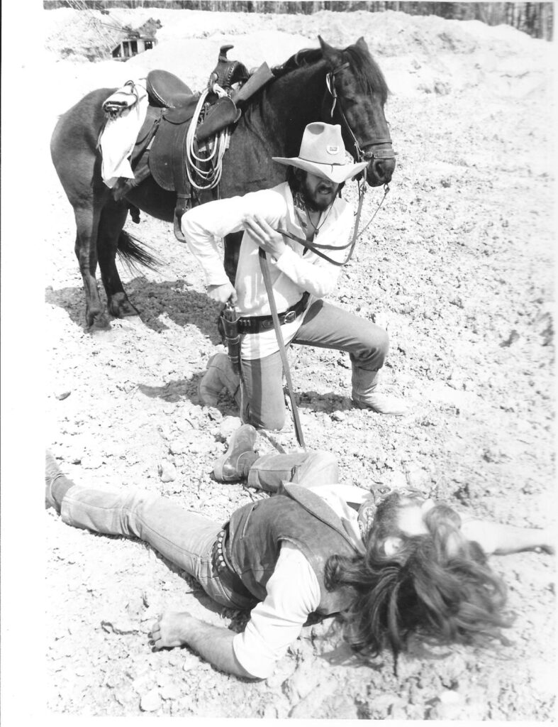 The bounty hunter Trampas (Malcolm JB Warriner) takes out gunsliger Barbo (Howard Payton) in "Saddle Tramp".