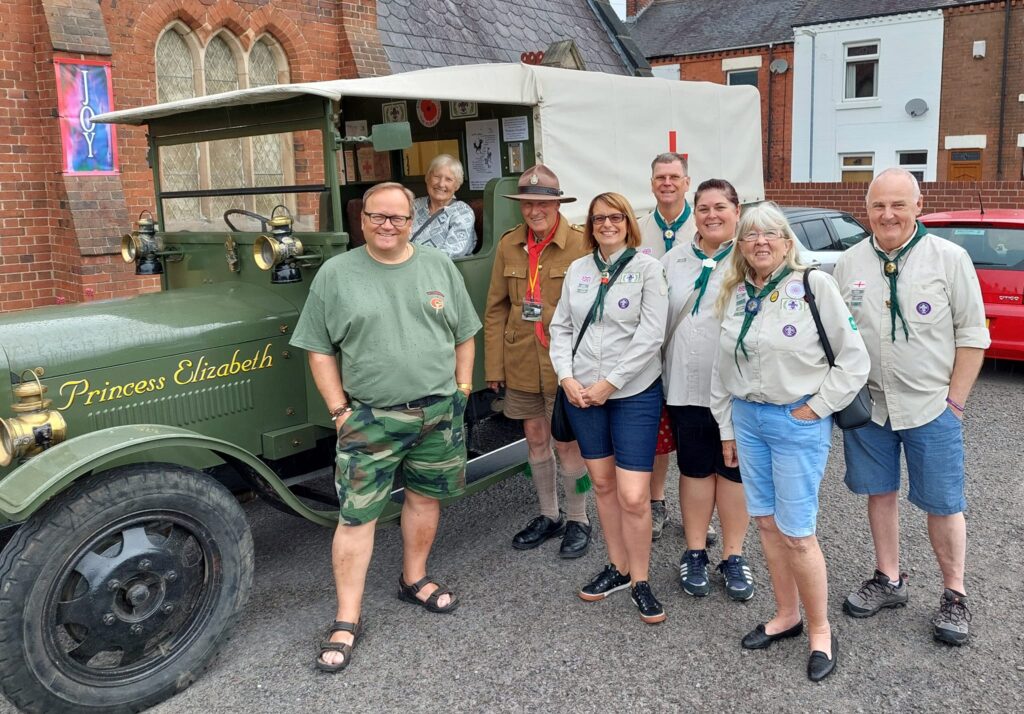 Swap Meet organiser Andy Yates with local scout leaders, and the Princess Elizabeth World War One ambulance, out side the Commando Swap Meet in Wolstanton. Photo via Andy Yates