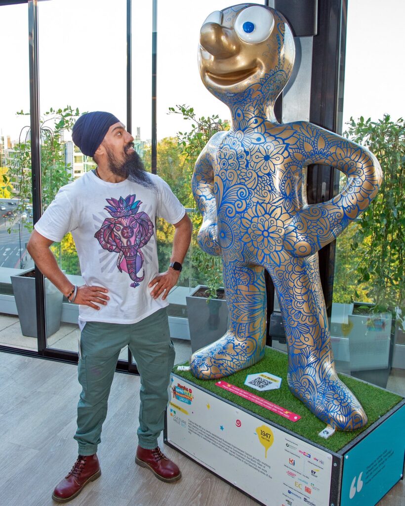 Artist Amrit Singh with his decorated Morph - Morph’s Epic Art Adventure in London